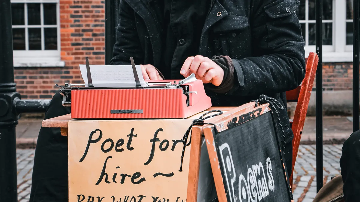 Managed AI writing services vs DIY tools: when to hire a vendor Managed AI writing services vs DIY tools: when to hire a vendor — Man Sitting on the Street and Writing Poems