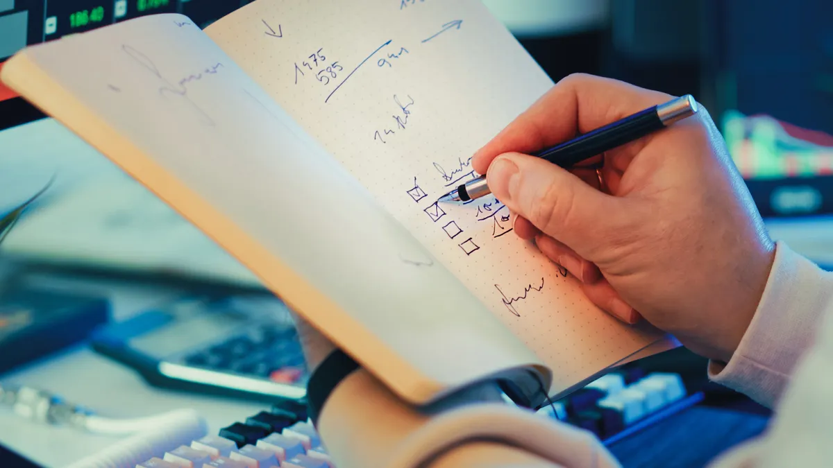 Premium AI Writing Services & Workflows — The Complete Guide Premium AI Writing Services & Workflows — The Complete Guide — Person Writing in Notebook for Stock Market Planning