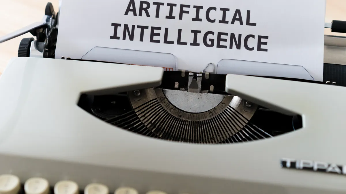 Typewriter with paper labeled artificial intelligence
